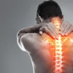 Inflamed spine X-ray superimposed on a person with back pain.