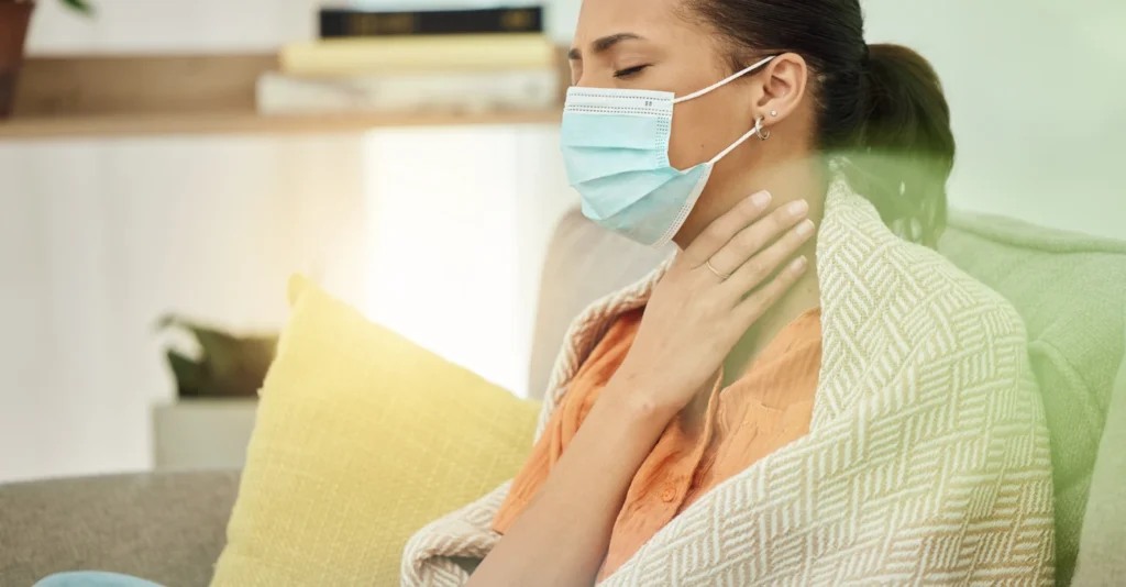 woman_sore_throat_face_mask