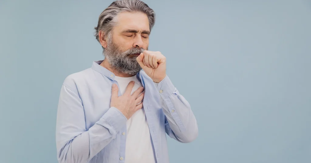 Man coughing showing bronchitis worsening into pneumonia.