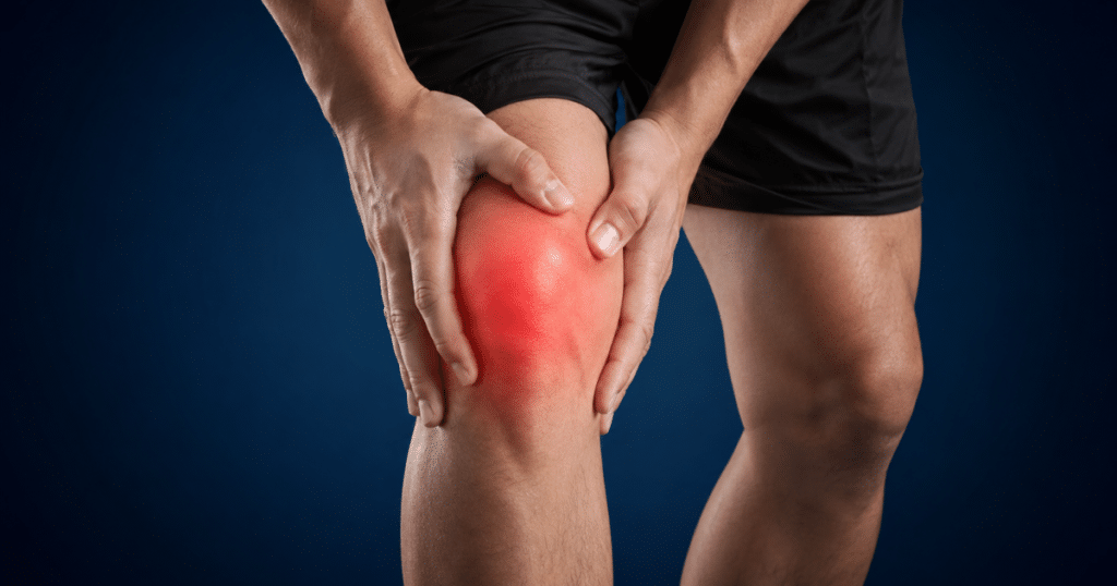 Swollen painful knee with red inflammation highlight.