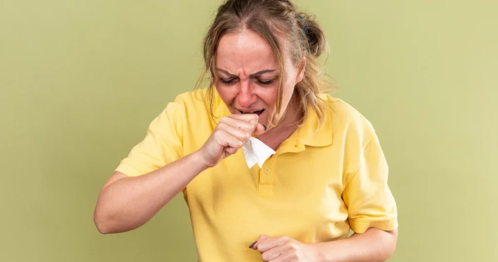 Sick woman coughing due to allergies